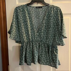 SHEIN green floral, peplum, blouse, size large. ruffled hem.